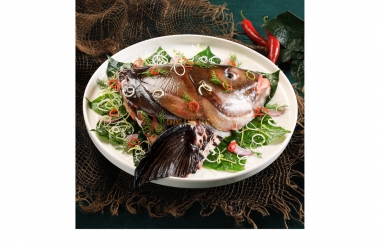 GIANT BARB FISH HEAD STEAMED WITH PIPER LOLOT LEAVES